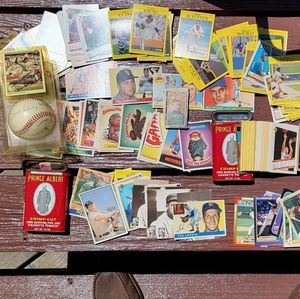 Autographed baseball and collector card plus stacks of various cards.